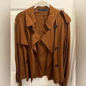 Zara short trench style jacket. It is unlined and thin but very stylish.